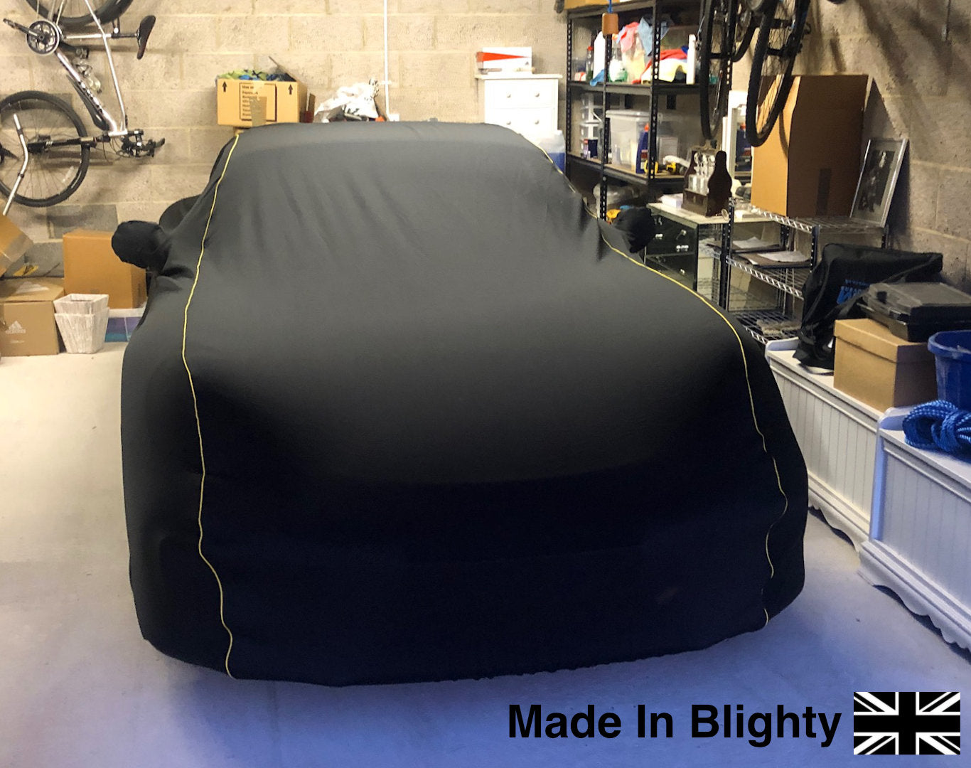 A Storm Car Covers Black Kalahari Fleece Indoor Car Cover with silver piping detail on a Porsche Turbo S